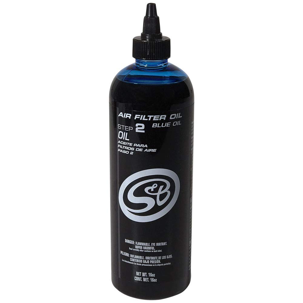 S&B blue oil applicator close-up showing precision tip and measured drops