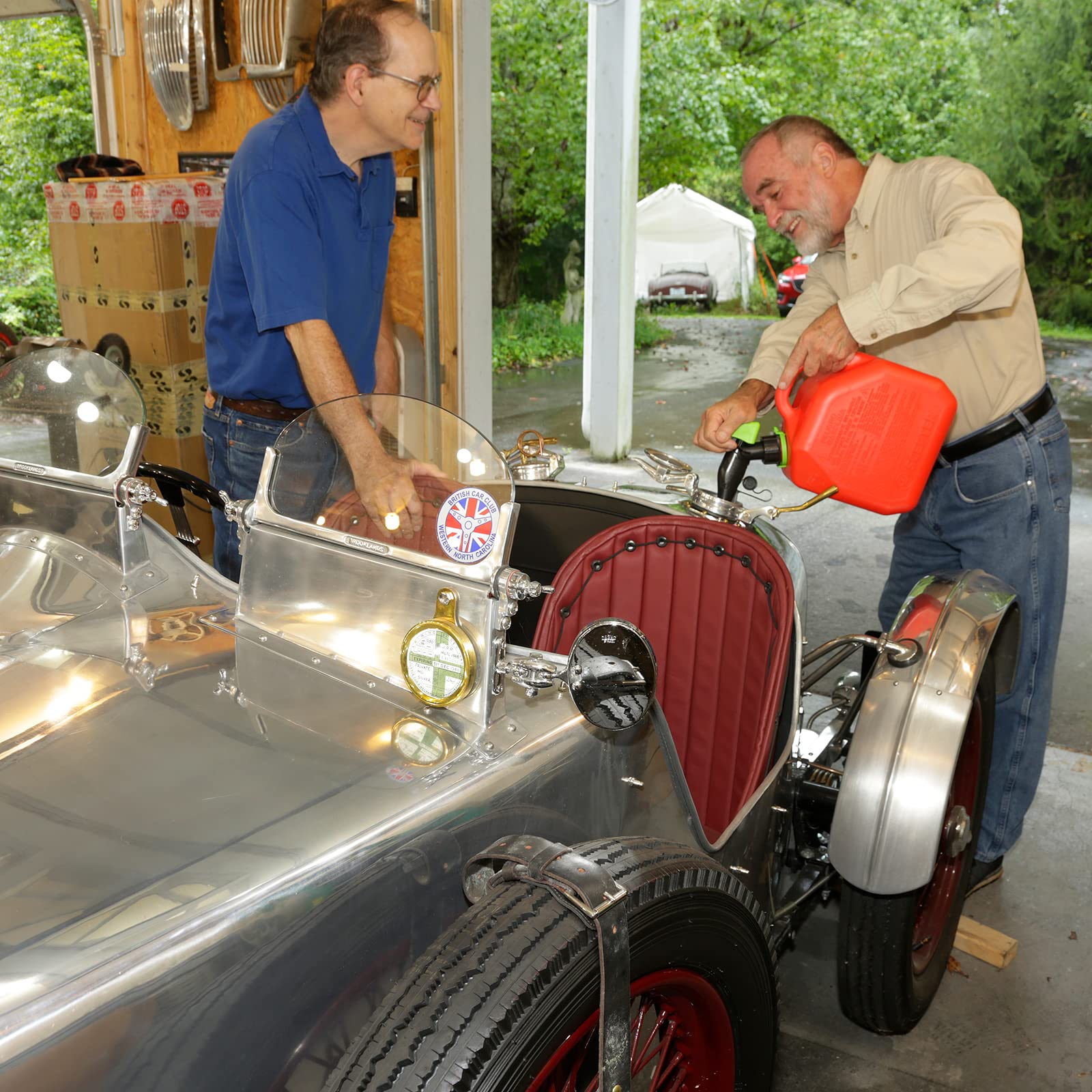 Scepter pouring gasoline into a lawnmower tank for fast hassle-free refills