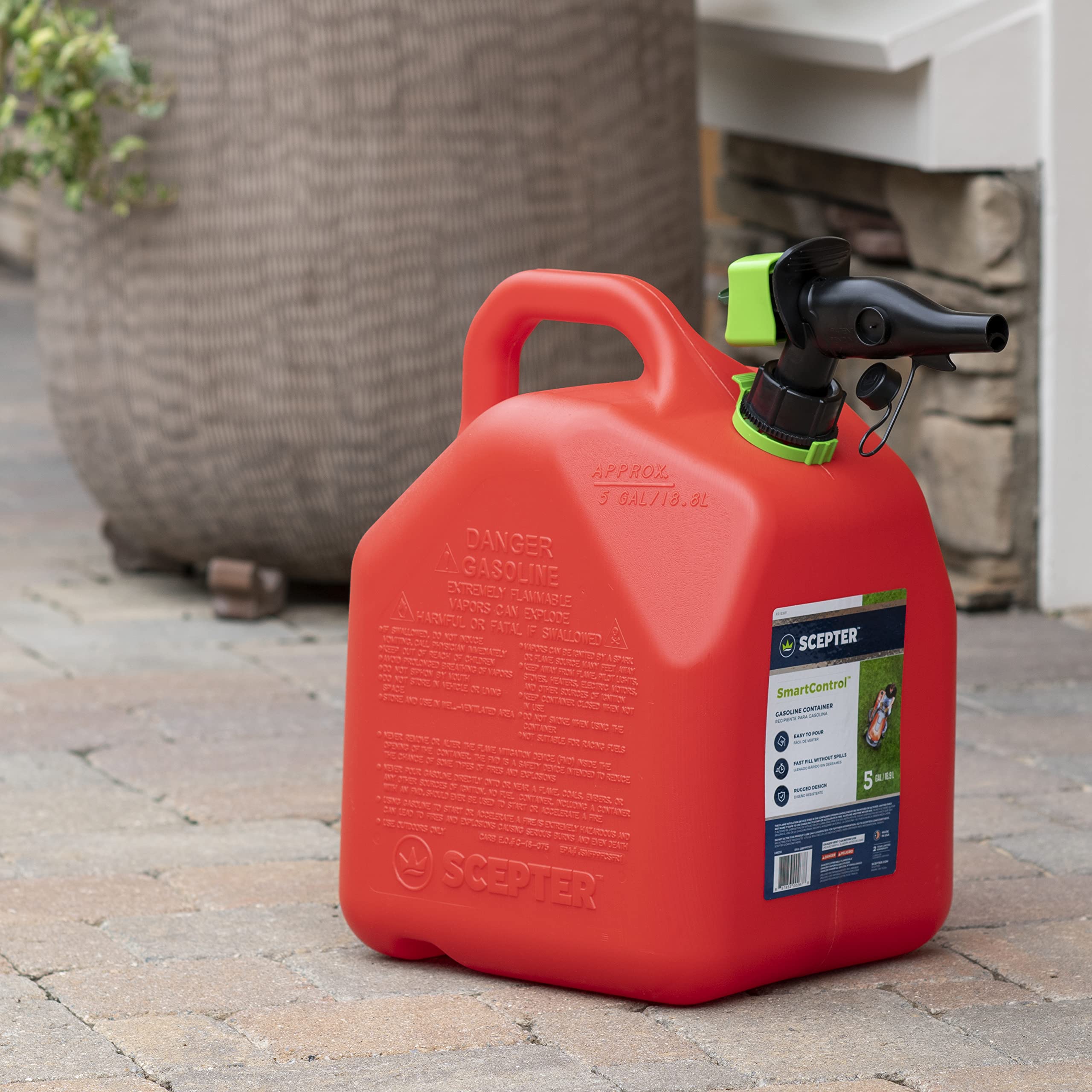 Scepter held in hand to illustrate one-gallon size and lightweight portability
