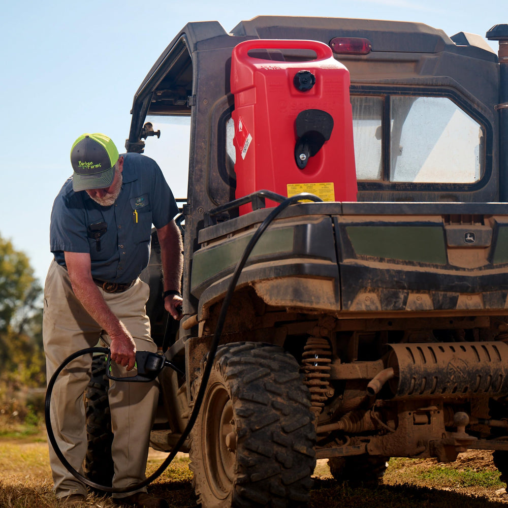 Scepter next to lawnmower to show 14-gallon size and practical scale