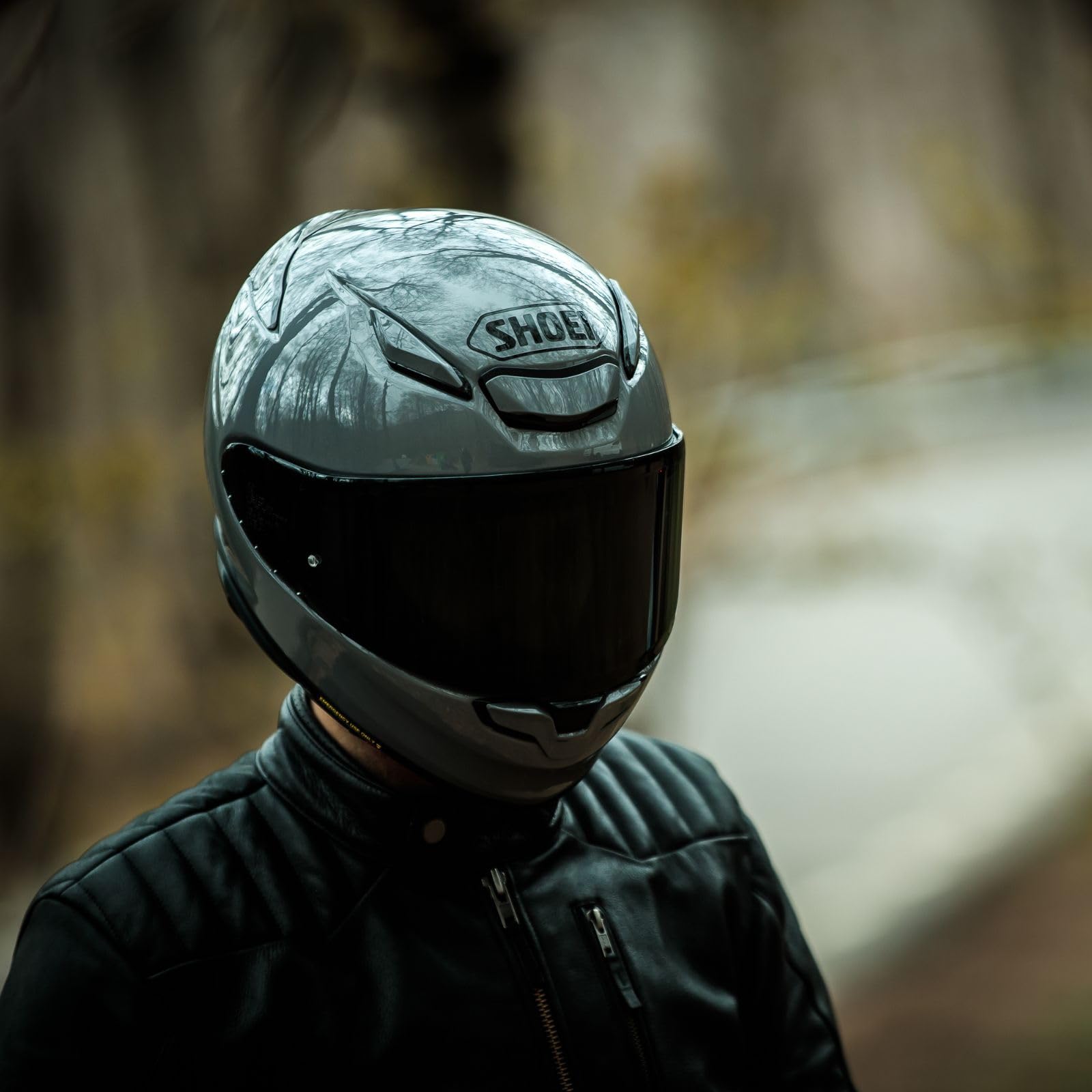 Shoei RF-1400 next to helmet bag showing compact size and portability