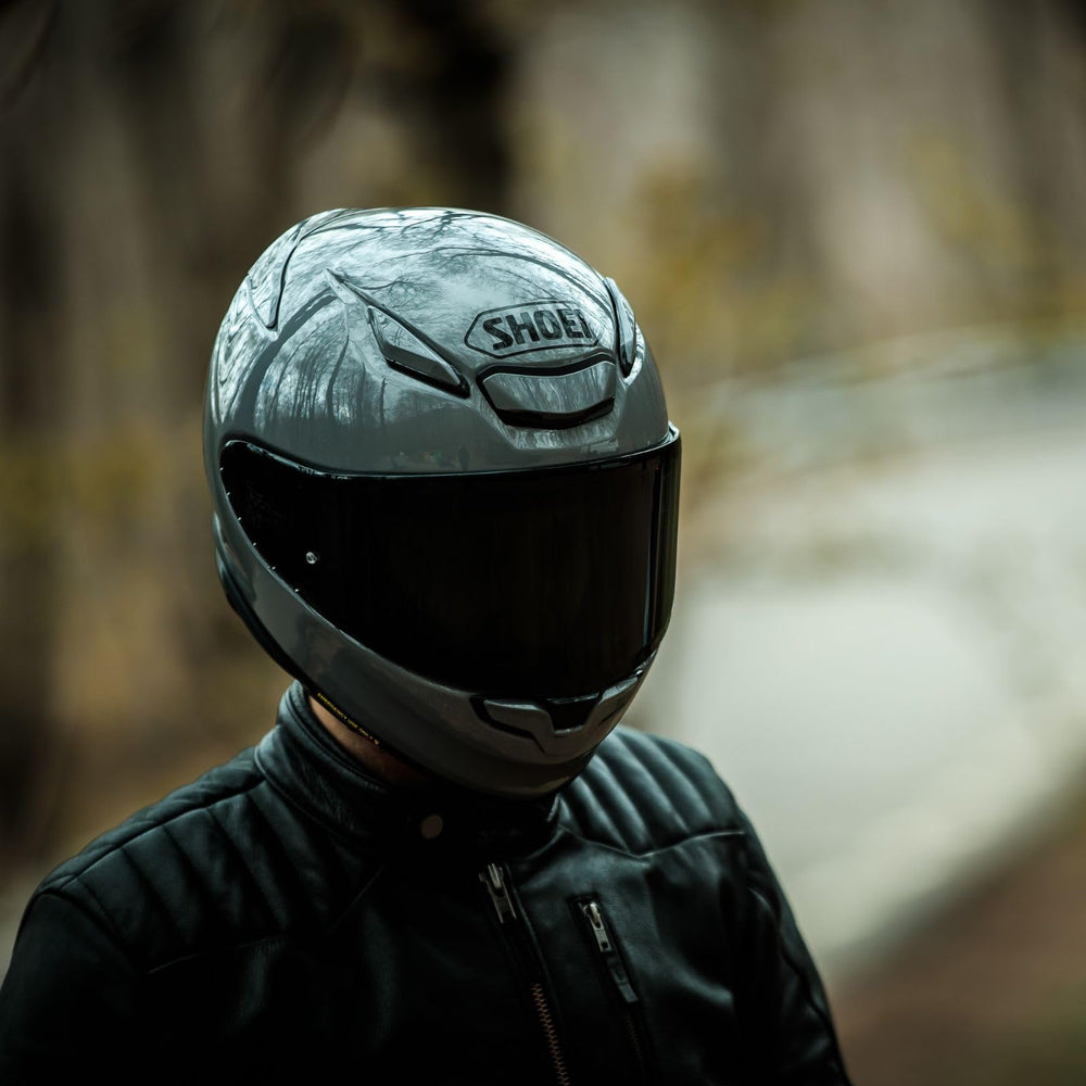 Shoei RF-1400 next to helmet bag showing compact size and portability