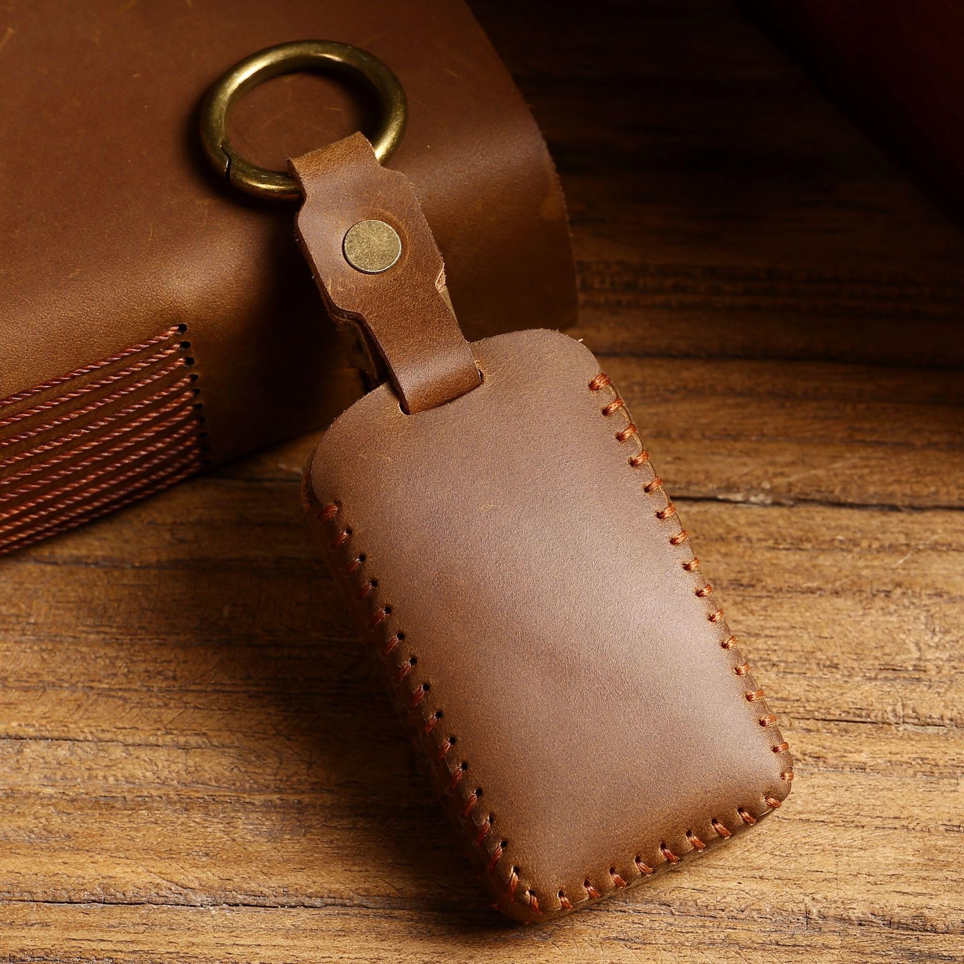 SIEVEN key fob in hand showing size and comfortable grip benefit