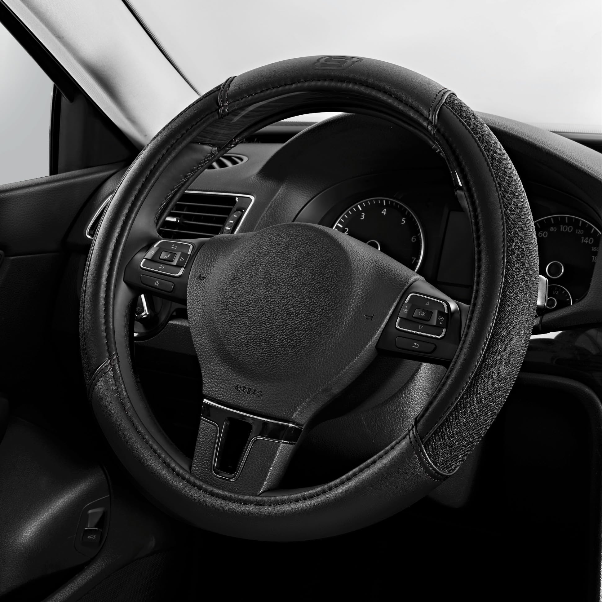Skechers front view of packaged steering wheel cover showing sleek black finish and branding