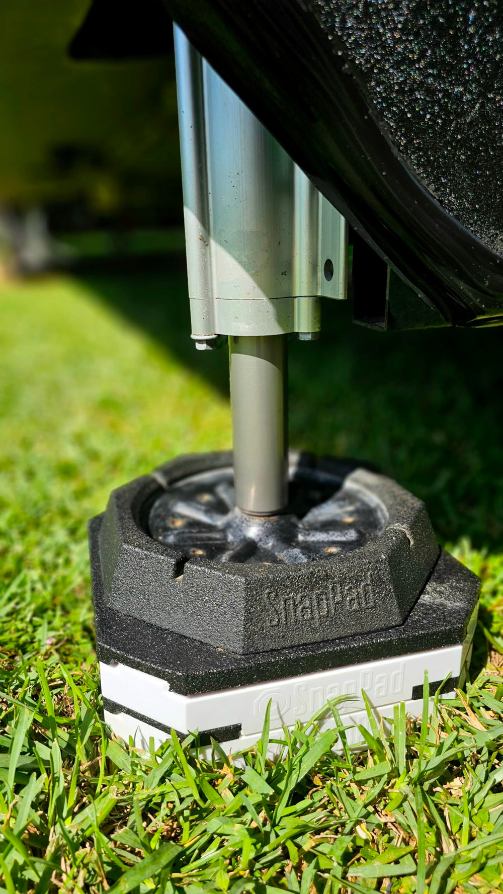 SnapPad at a campsite stabilizing a travel trailer for safer setup