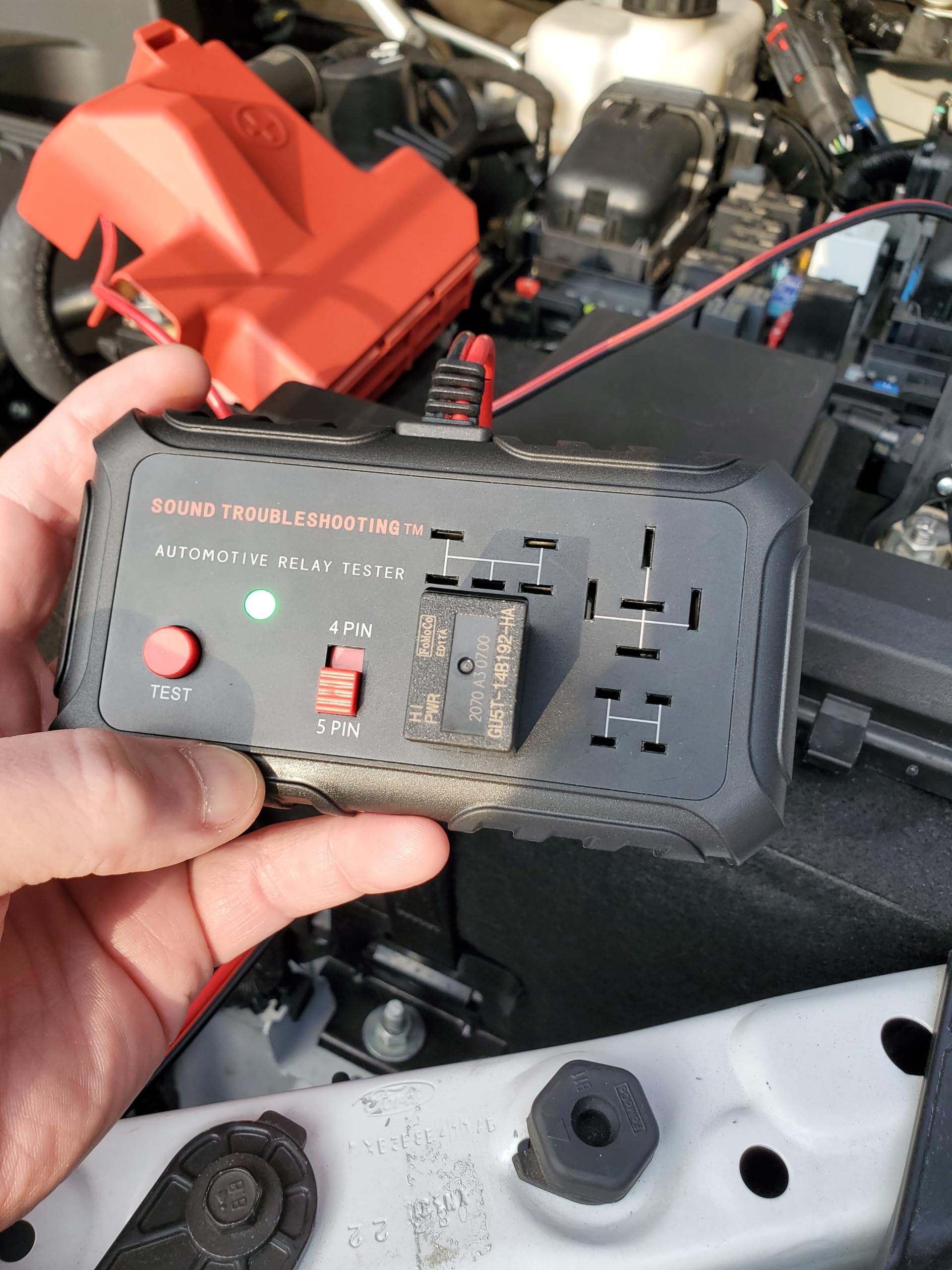 Sound Troubleshooting close-up of relay inserted into socket, ensuring correct contact fit