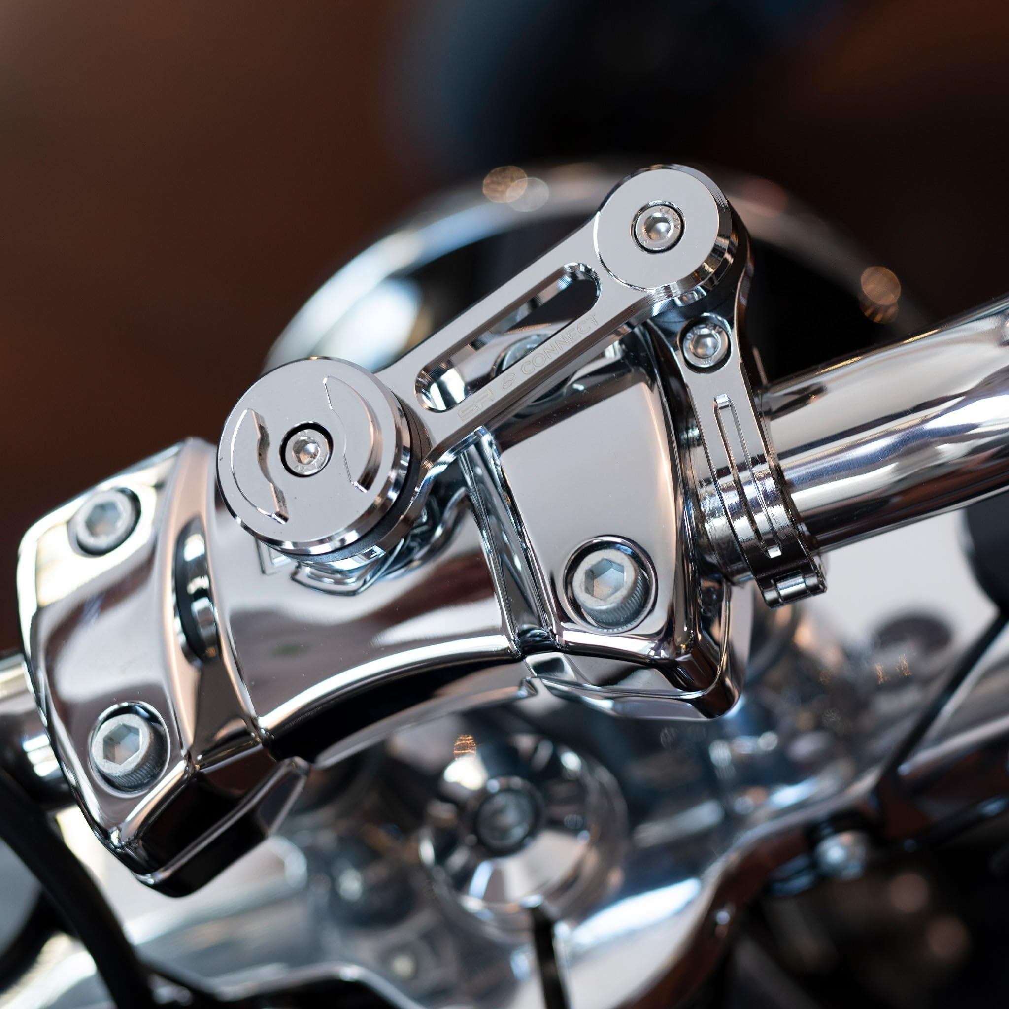 SP CONNECT mounted on motorcycle in traffic showing practical hands-free use