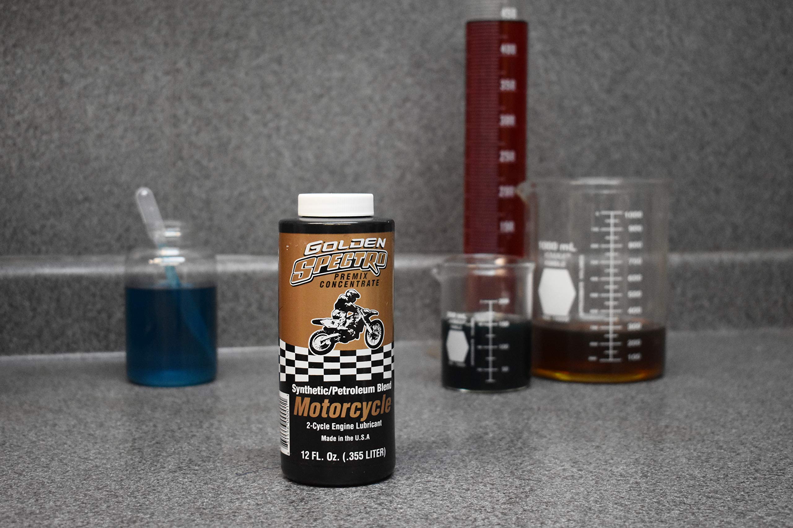 Spectro Oil close-up of golden fluid texture highlighting cleaner-burning formulation