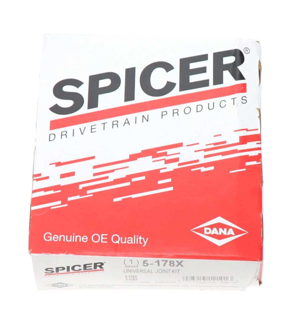 Mechanic installing Spicer U-joint in garage showing professional replacement benefit