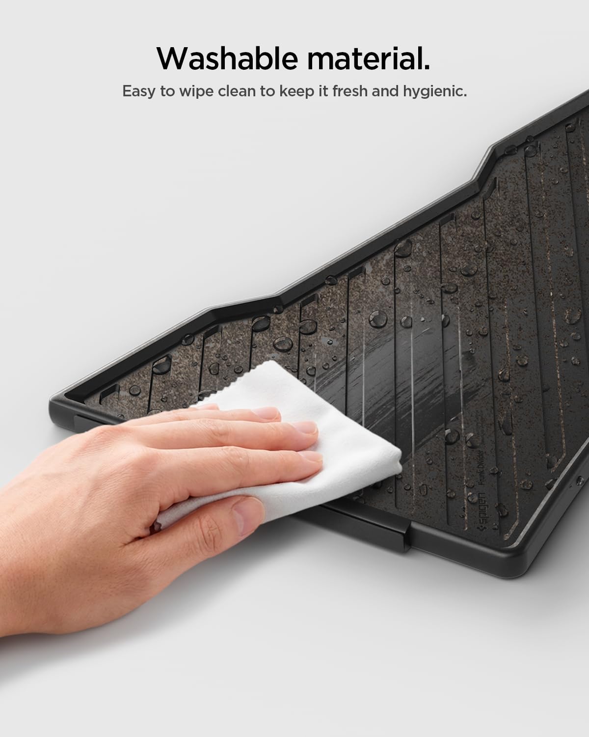 Spigen divider in lifestyle scene with travel bags showing tidy frunk use