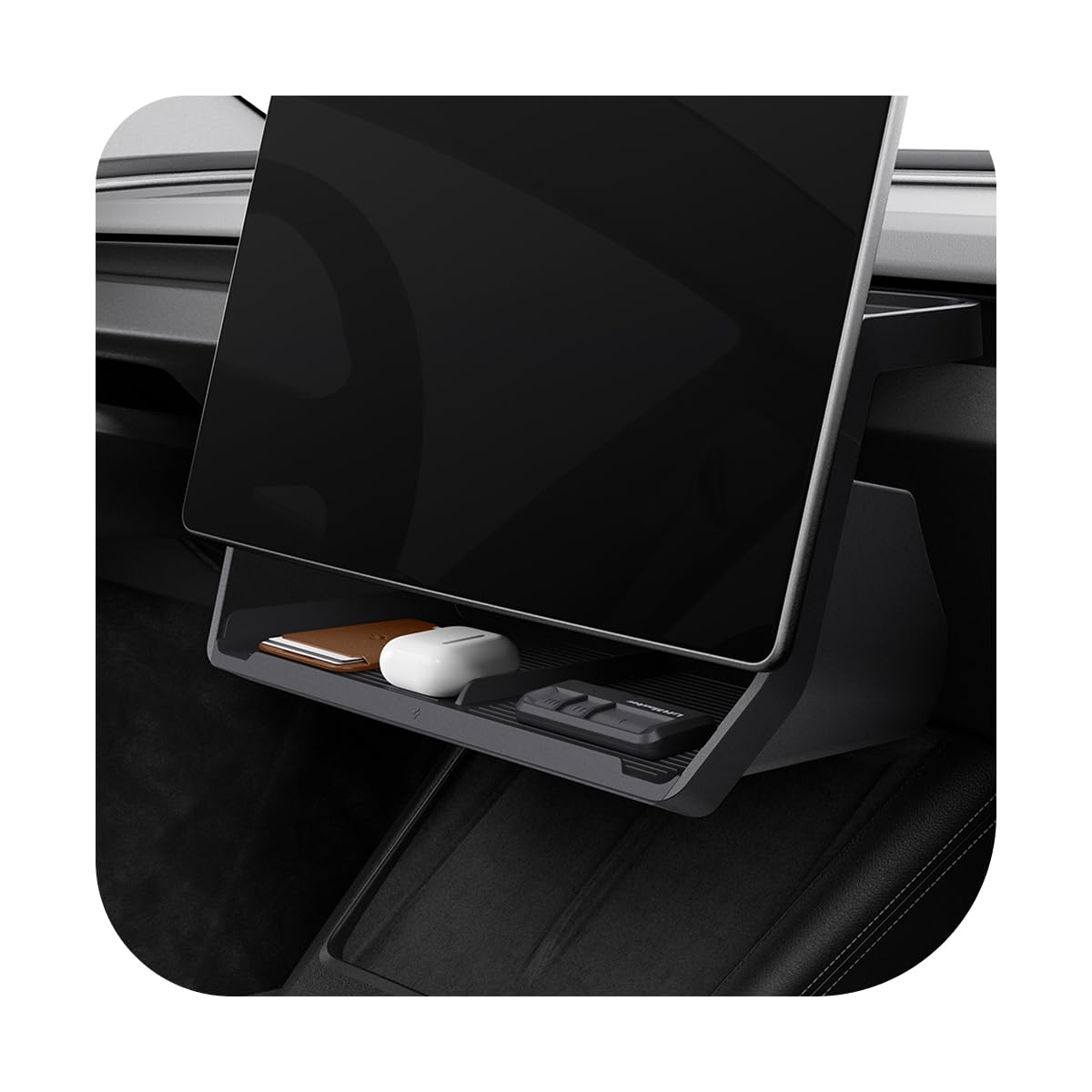 Spigen front installed under-screen tray in Tesla showing neat storage and easy access