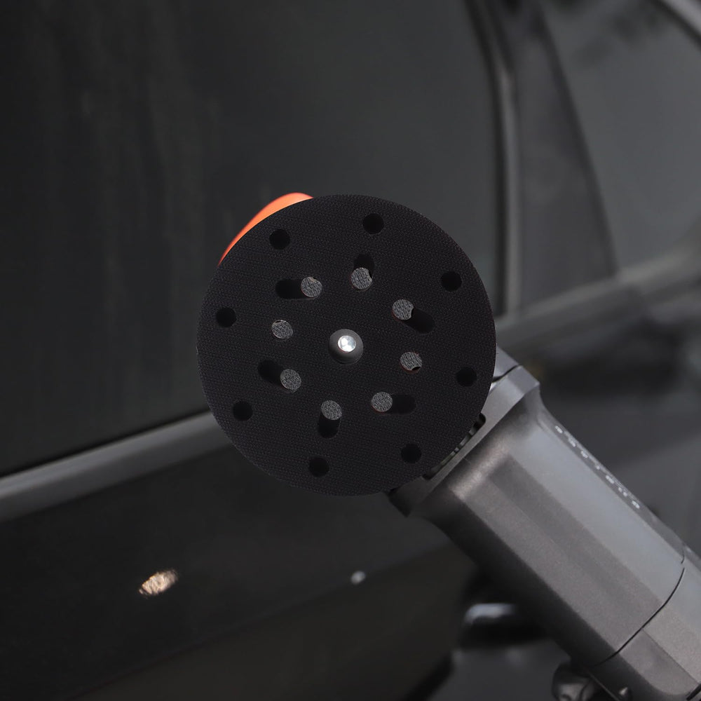 SPTA backing plate used in auto detailing scene for professional finish