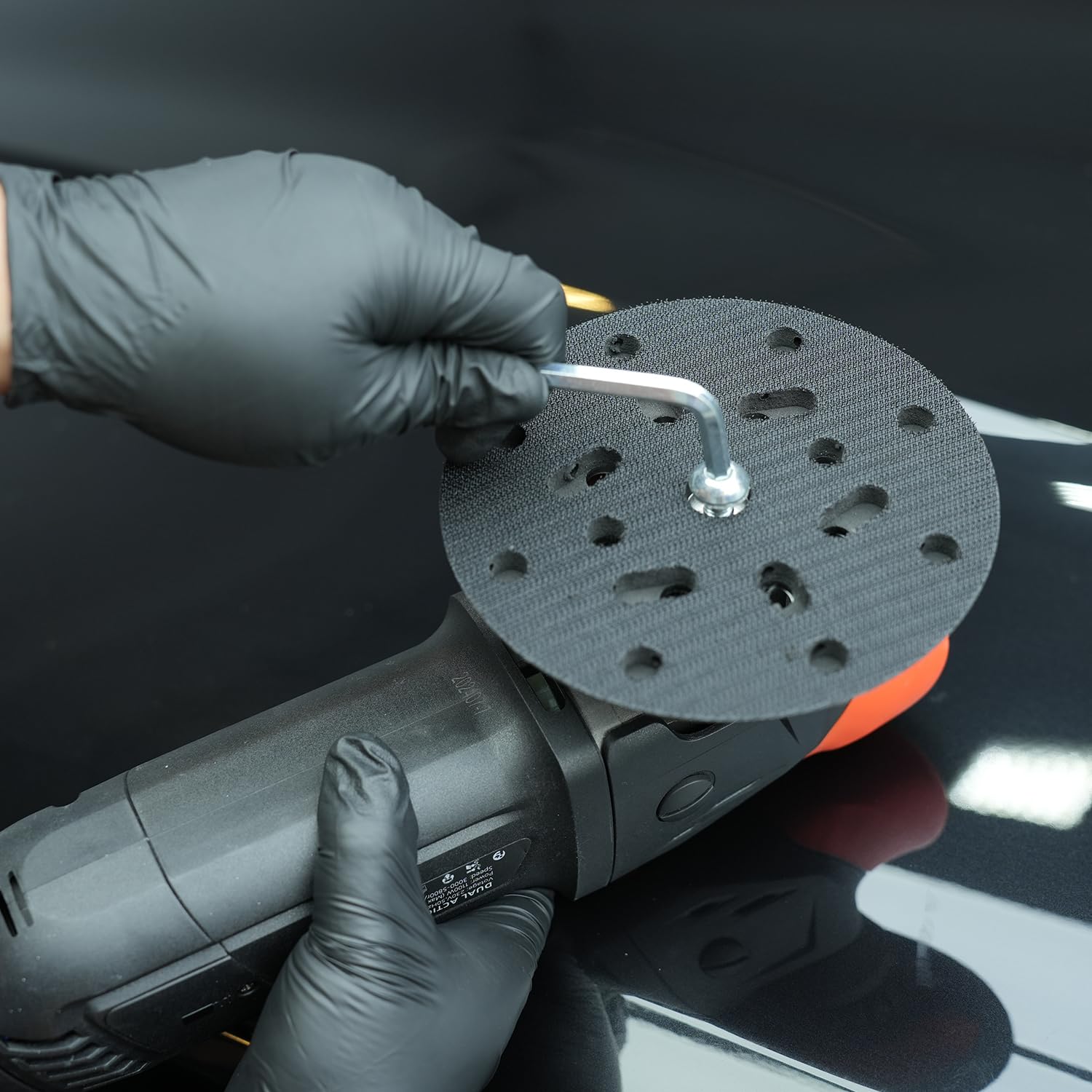 SPTA backing plate next to ruler showing scale for accurate pad selection