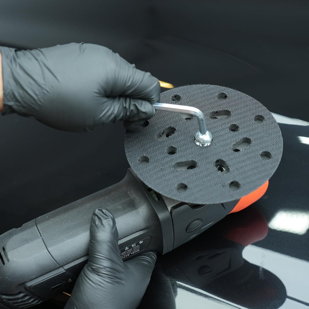 SPTA backing plate next to ruler showing scale for accurate pad selection
