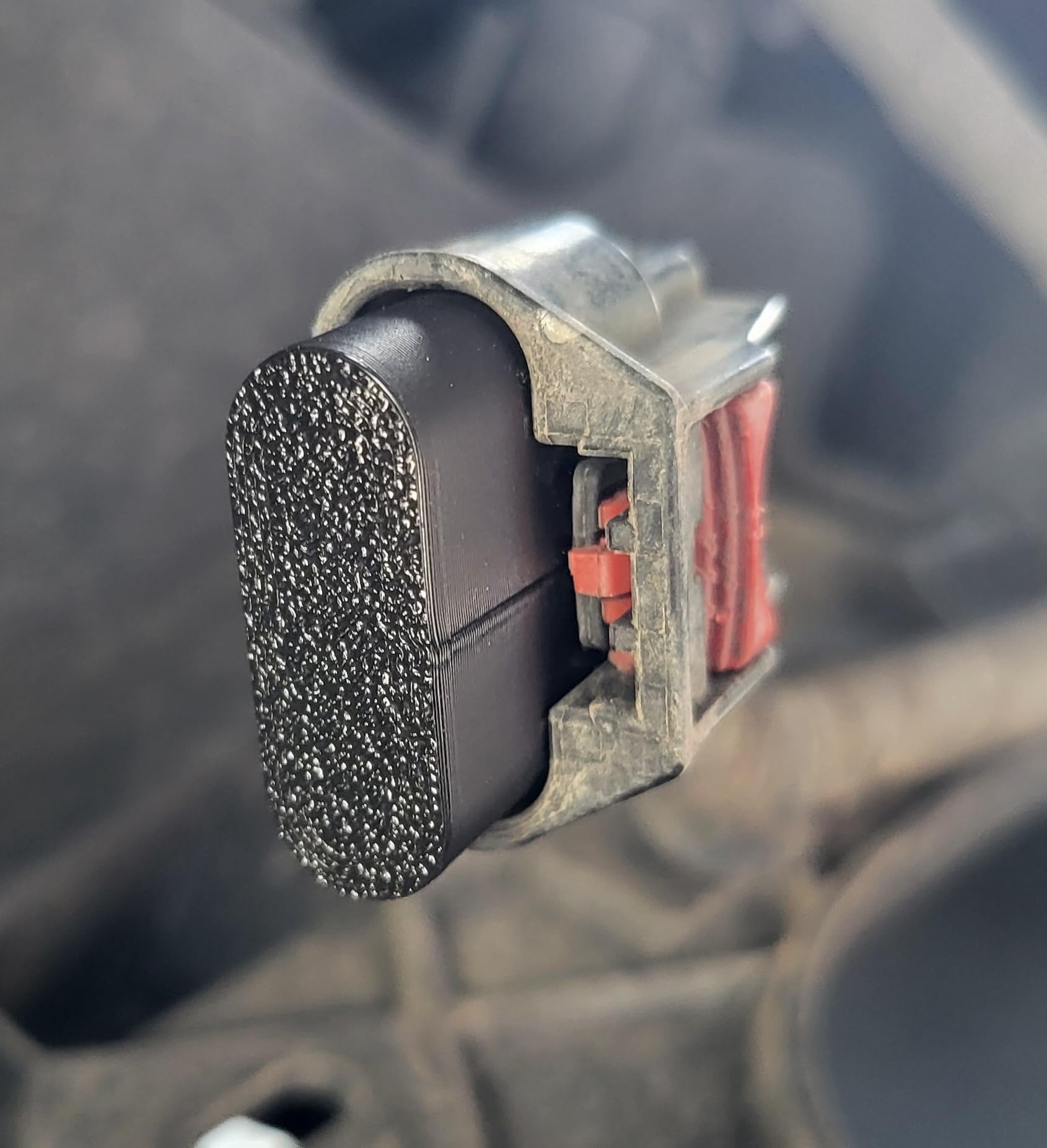 SPWM cap held in hand showing size and easy tool-free installation benefit