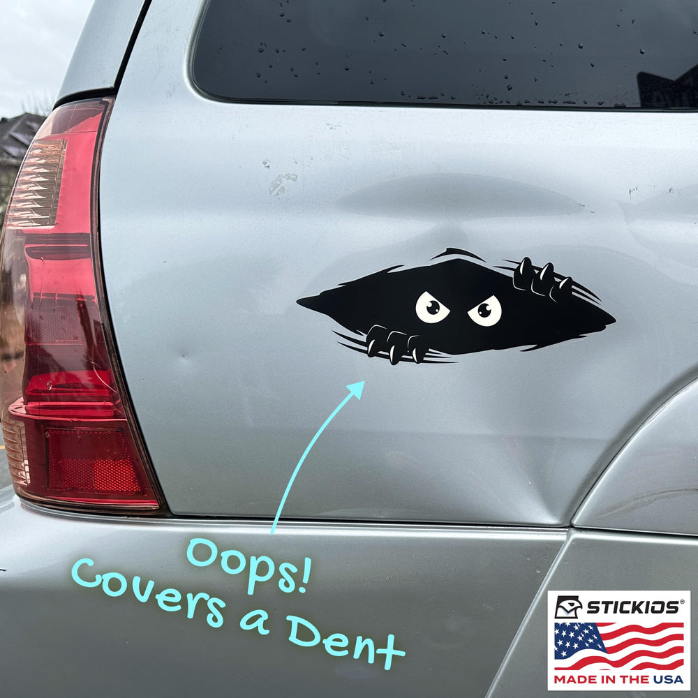 Stickios Shredder and Peekaboo applied to car bumper demonstrating secure adhesion
