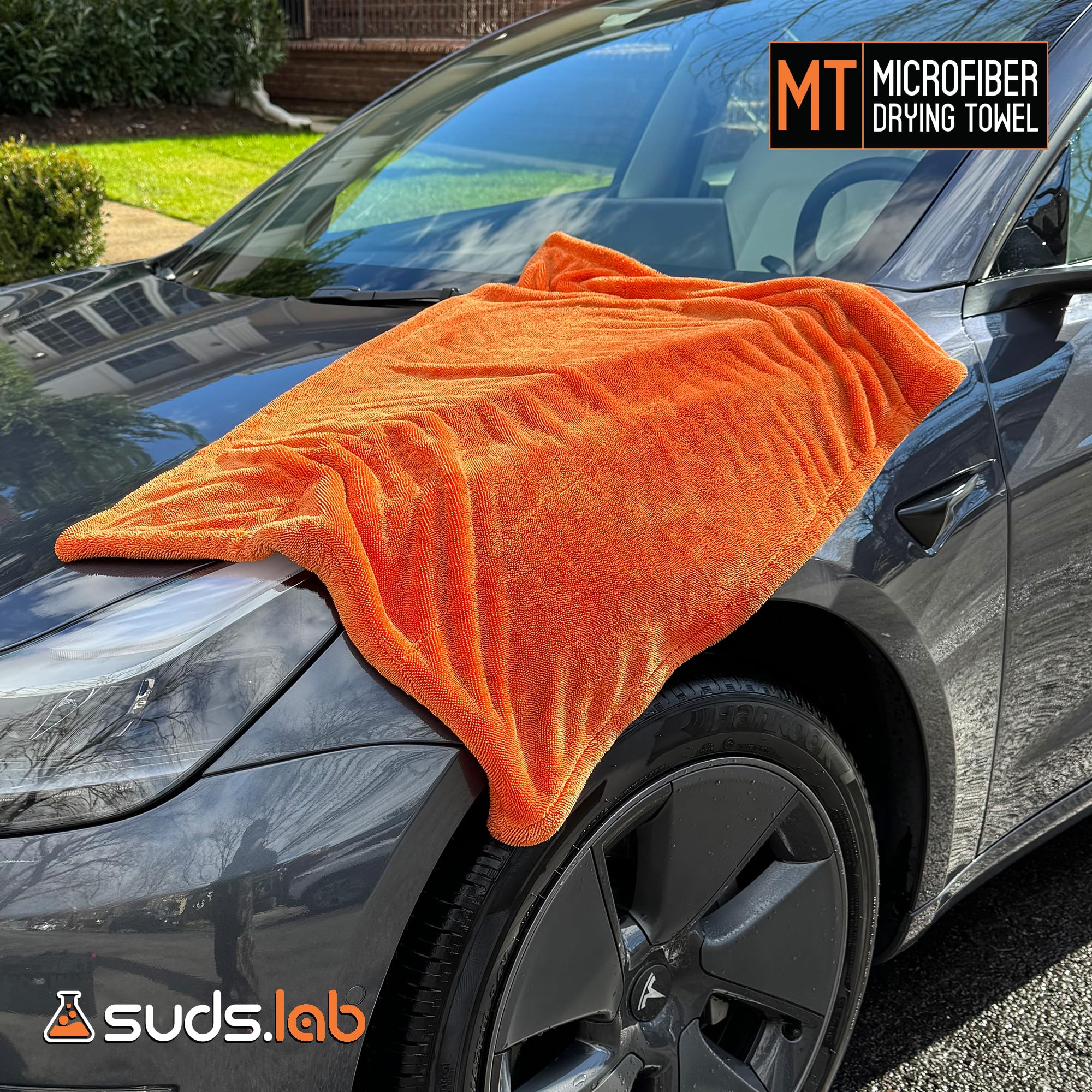 suds.lab towel on chrome trim providing gentle polishing and shine preservation