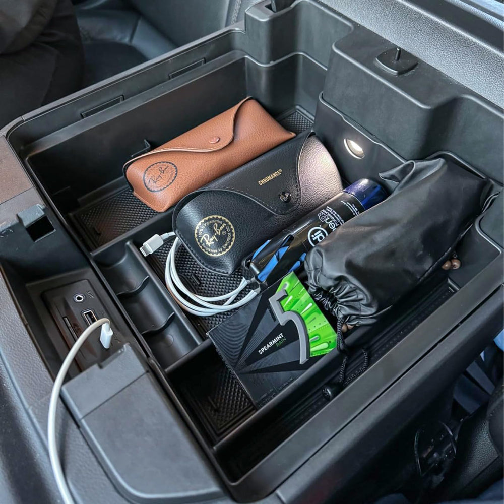 TACOBRO lifestyle driving shot showing organized console during commute