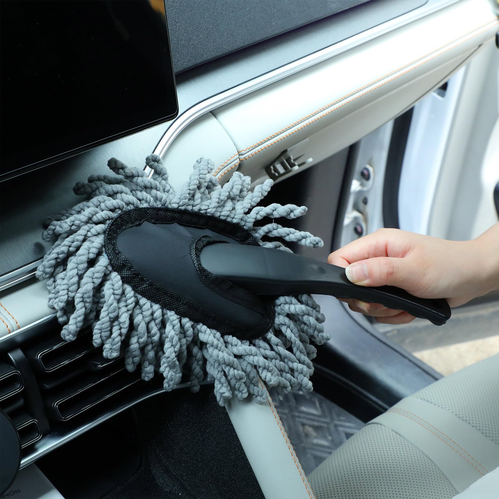 Tanlade duster used on dashboard vents and controls, detailing interior surfaces safely