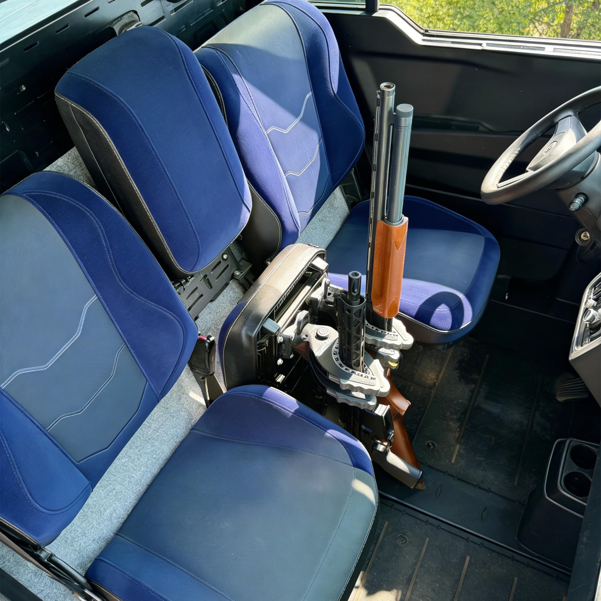 telfair installed under a Can Am Defender seat securing firearms and reducing clutter