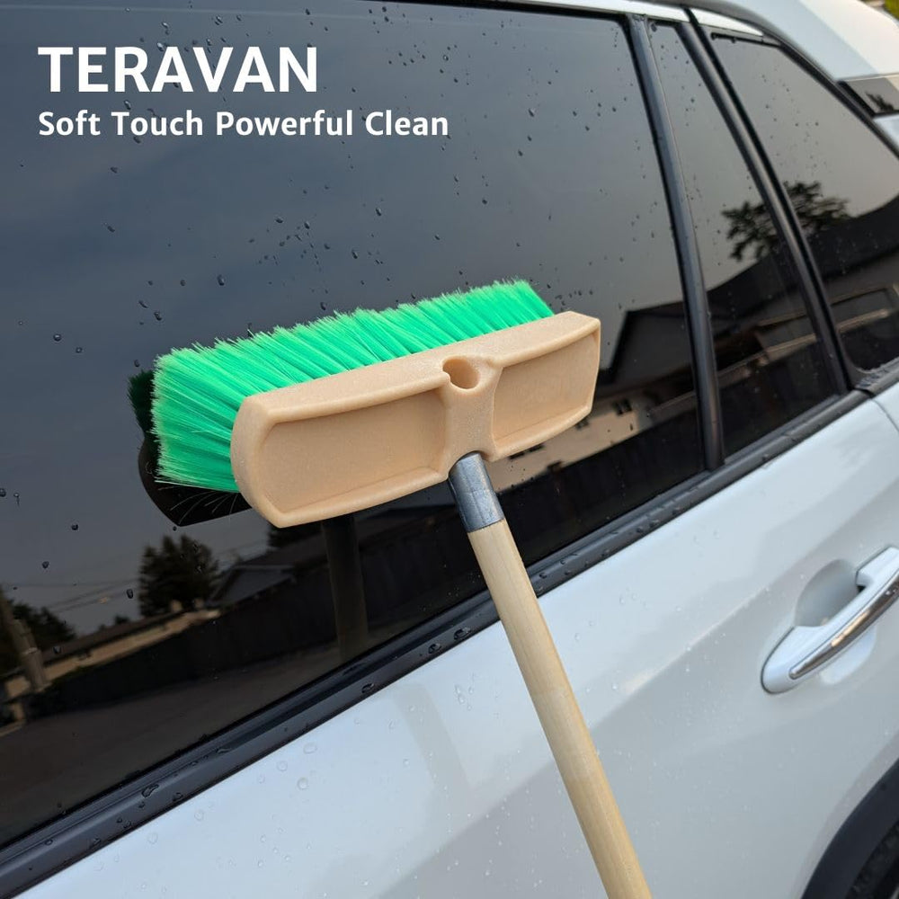 Teravan brush held in hand for scale emphasizing 10-inch size and precise maneuverability