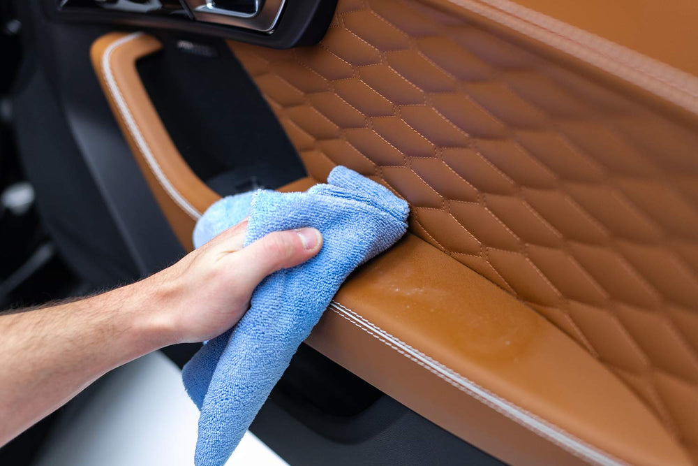 The Rag Company towel on a garage bench with detailing tools showing professional setup benefit