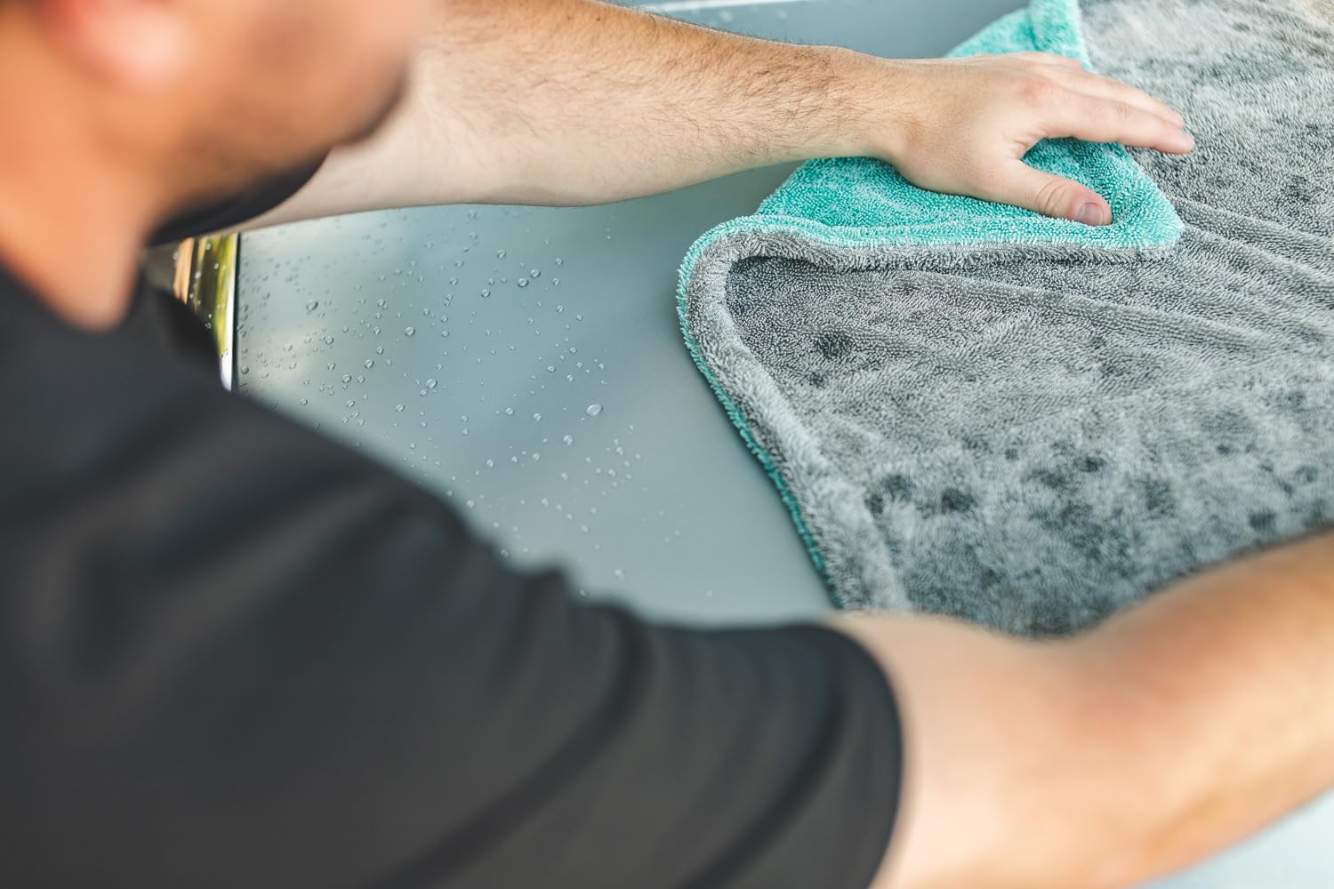 The Rag Company Liquid8r held by hand to show 20x24-inch size advantage