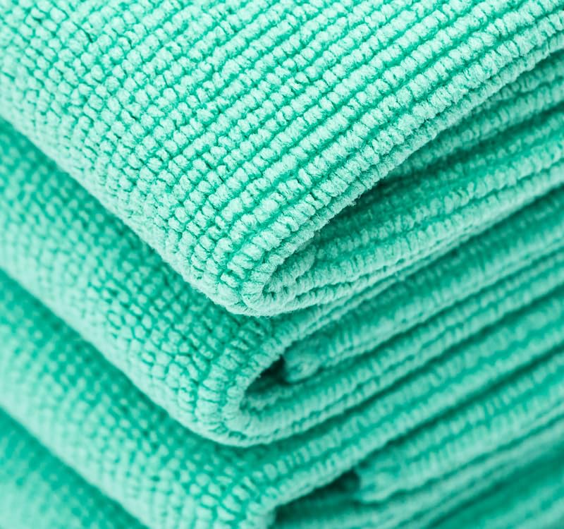 The Rag Company towel in use removing coating residue demonstrating safe leveling benefit