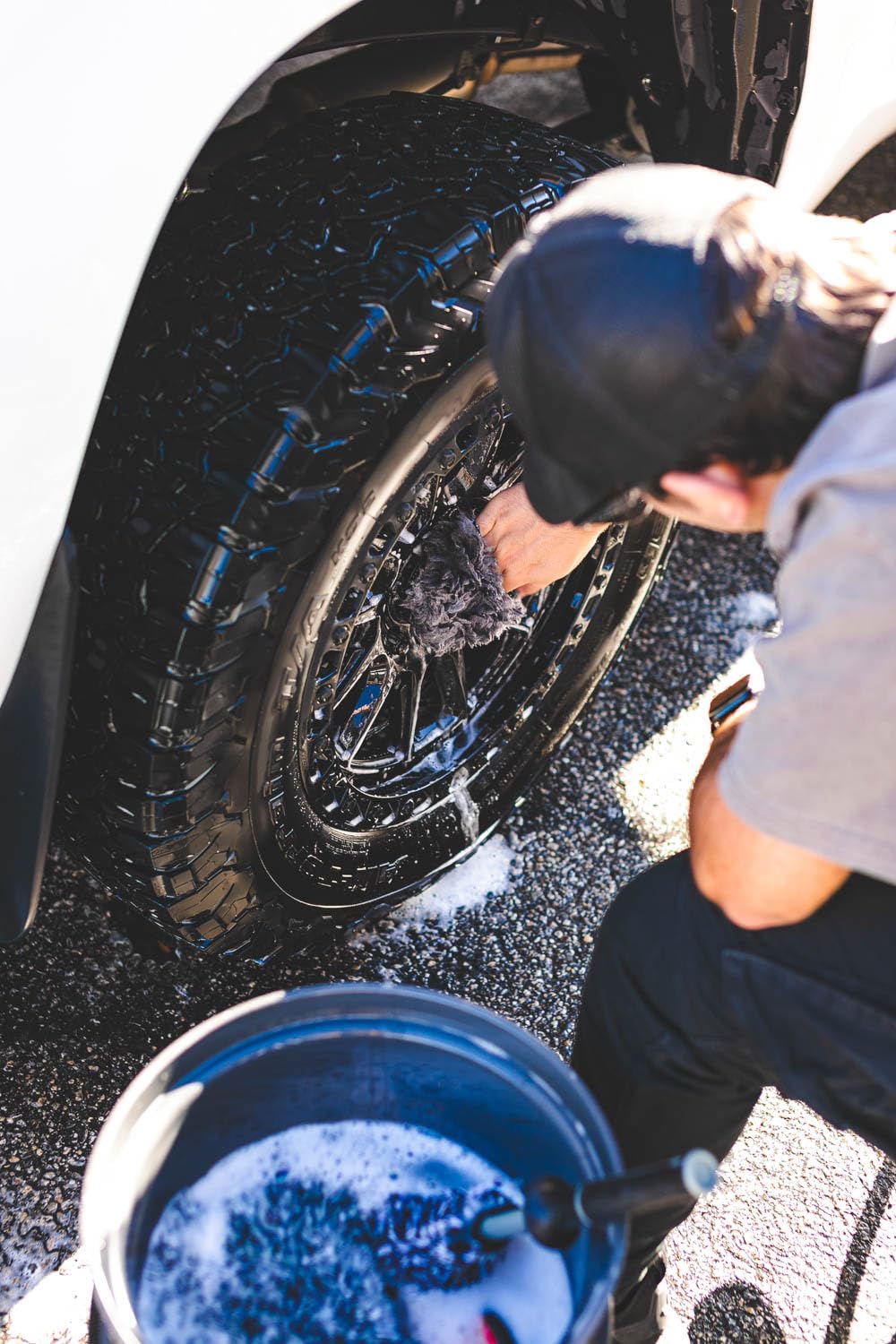 The Rag Company mitt in use on a spoke providing gentle scrubbing without marring