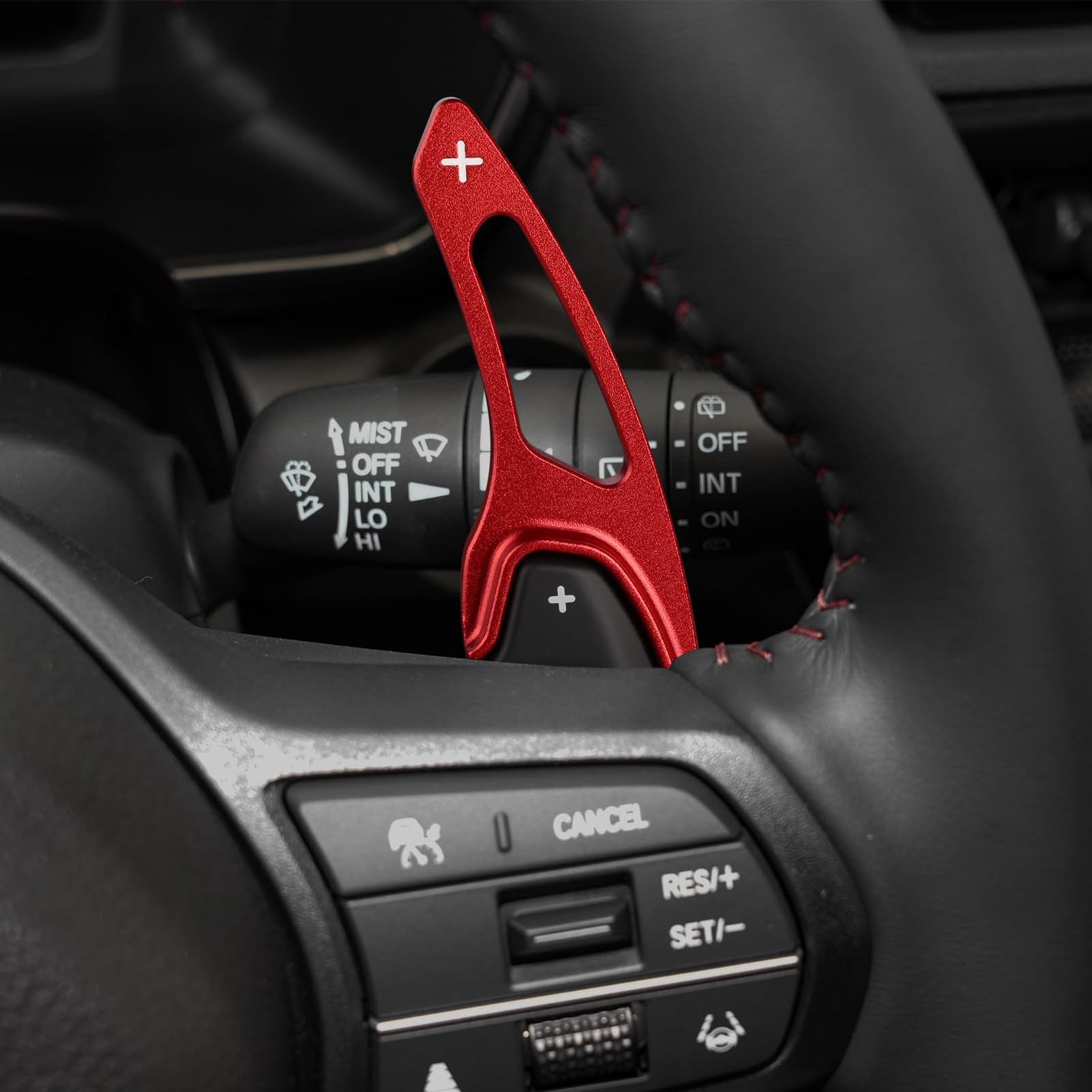 Thenice installed on steering paddle showing improved reach and fingertip access
