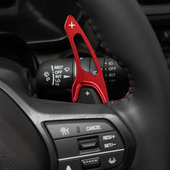 Thenice installed on steering paddle showing improved reach and fingertip access