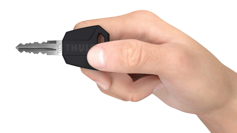 Thule one-key system comfort key closeup highlighting ergonomic grip and ease