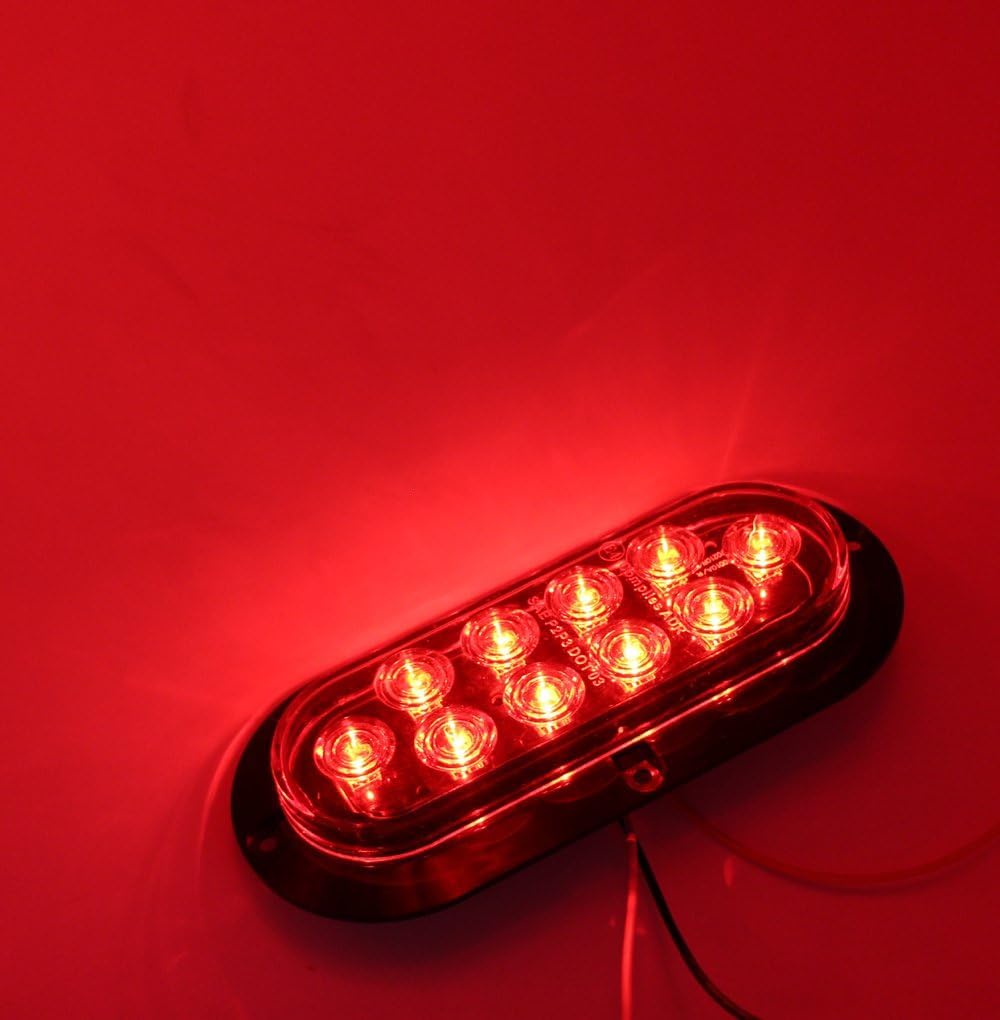 TMH tail light held in hand for size scale showing compact design and easy fit