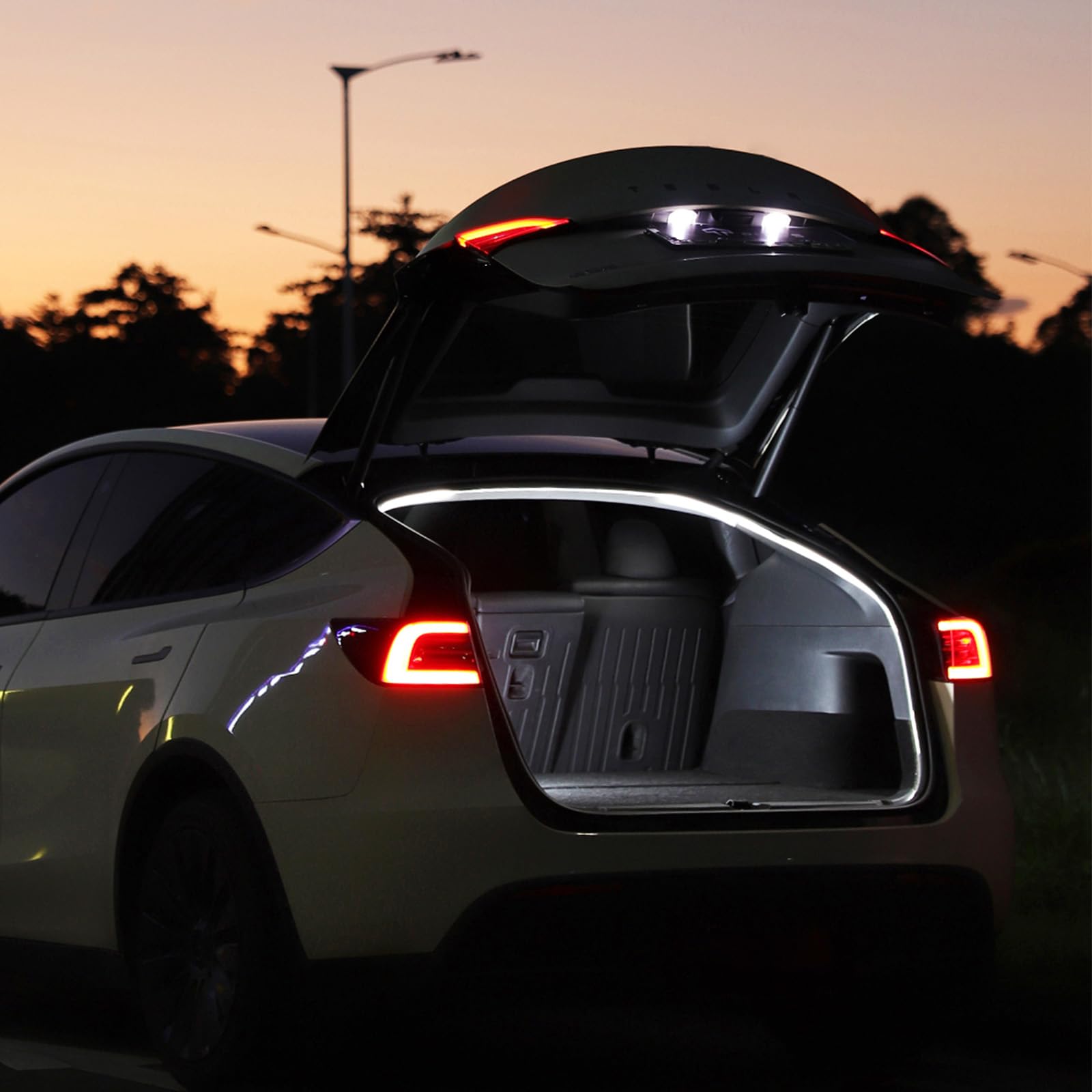 TPARTS lifestyle garage scene showing trunk light enhancing evening loading
