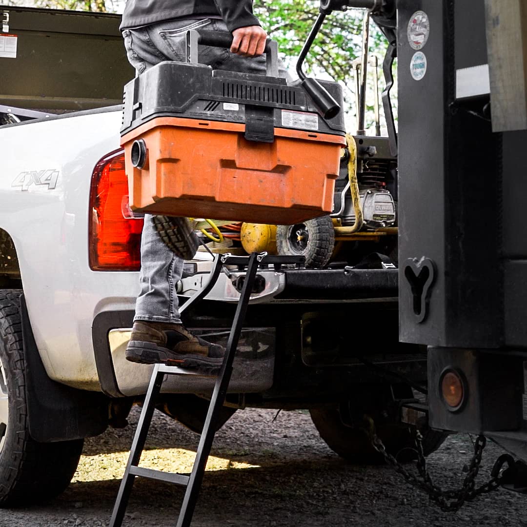 Traxion ladder beside person to show scale and full 28–42 inch tailgate fit