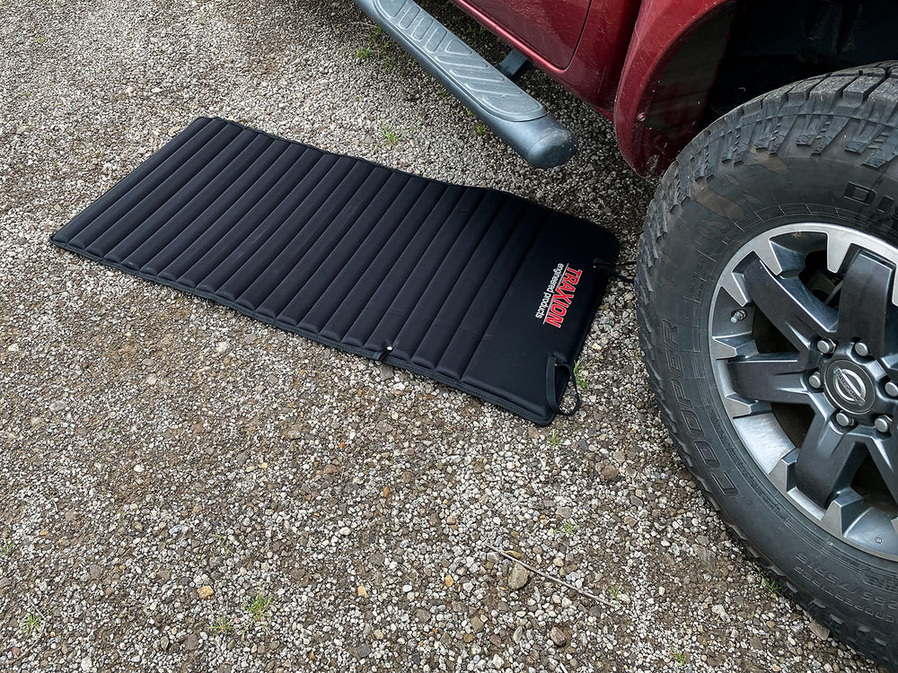 Traxion VersaMat used for kneeling in garden offering knee comfort and clean surface