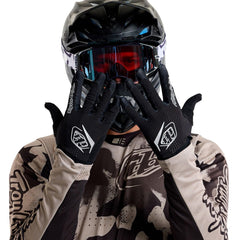 Troy Lee Designs glove worn on handlebars showing grip control and tactile feel benefit