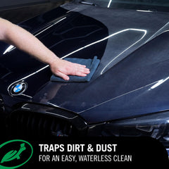 Turtle Wax being wiped on painted panel showing instant shine and protection