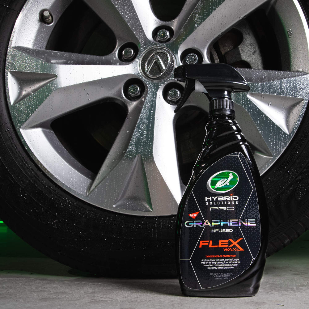 Turtle Wax spraying onto car paint, demonstrating easy application and quick shine