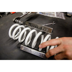TUSK size comparison beside a wrench showing compact portability and fitment