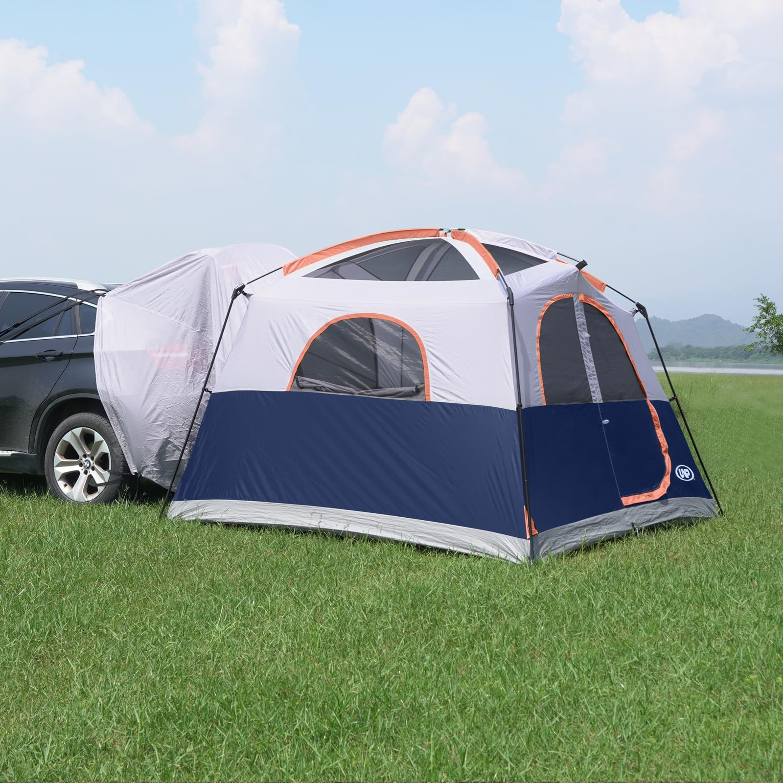 unp tent beside SUV showing scale and how it expands vehicle capacity