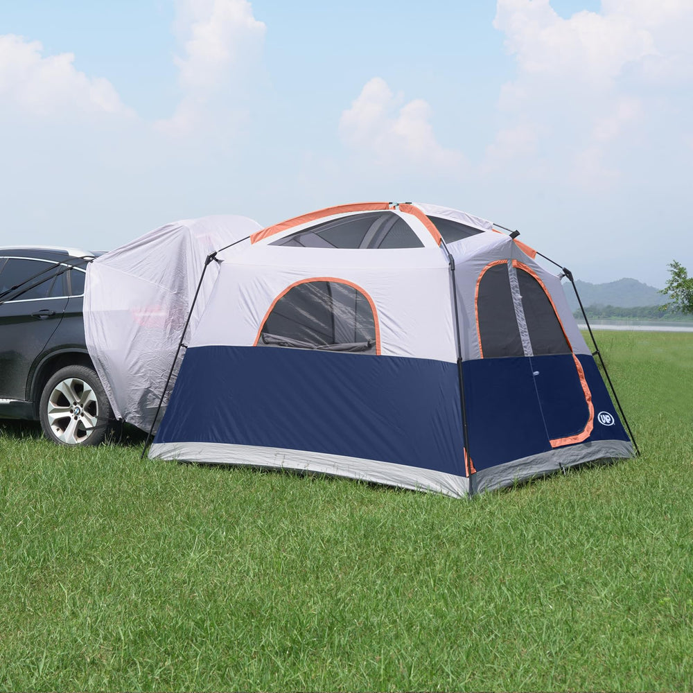 unp tent beside SUV showing scale and how it expands vehicle capacity
