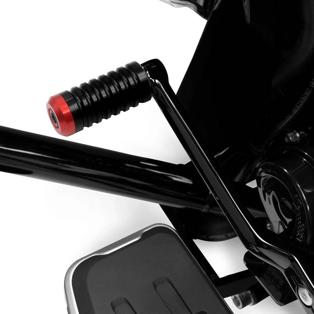 Unrestricted Walk shifter peg on motorcycle in motion showcasing style while riding