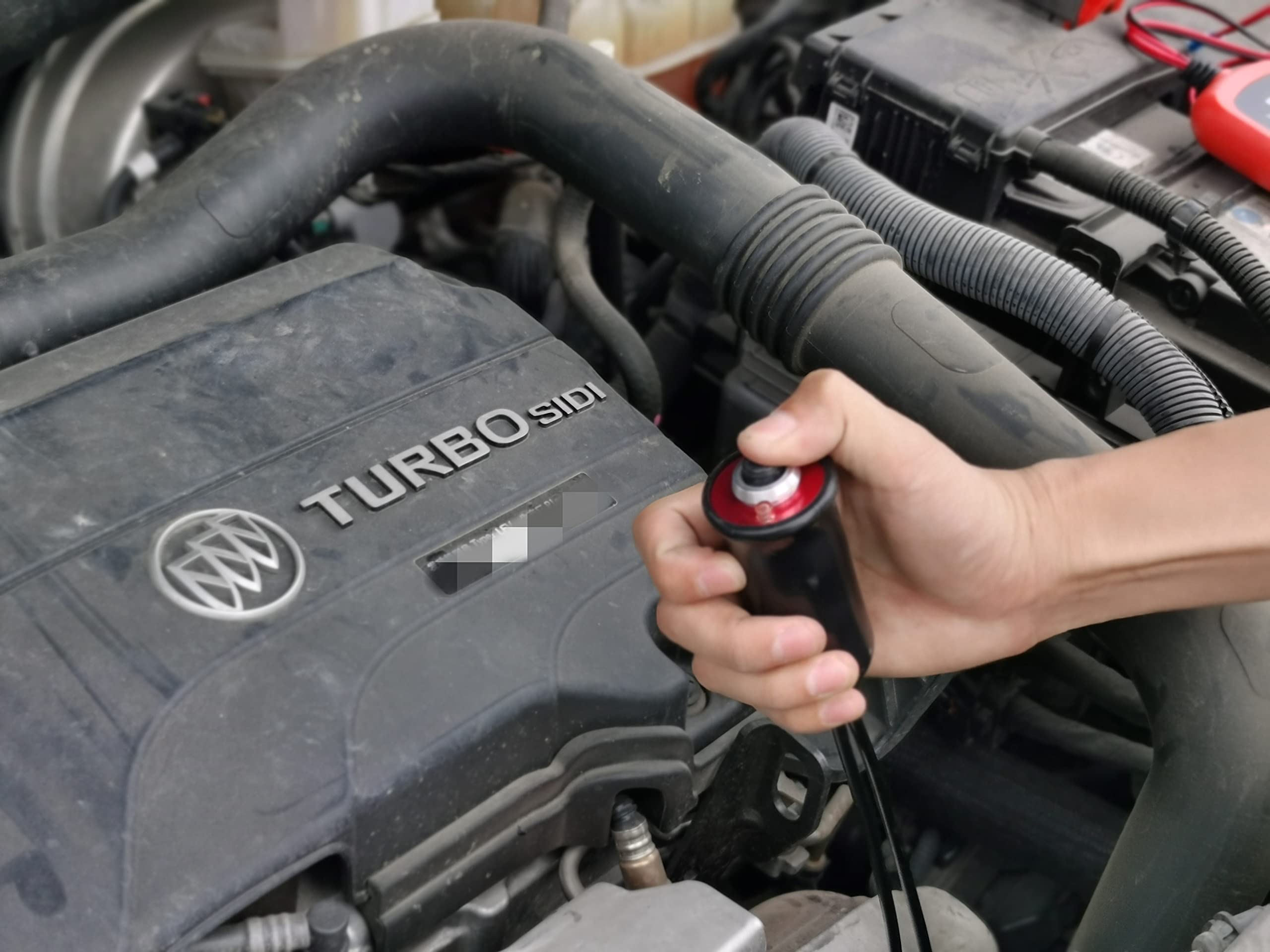 VCC remote starter in use under hood for hands-free cranking