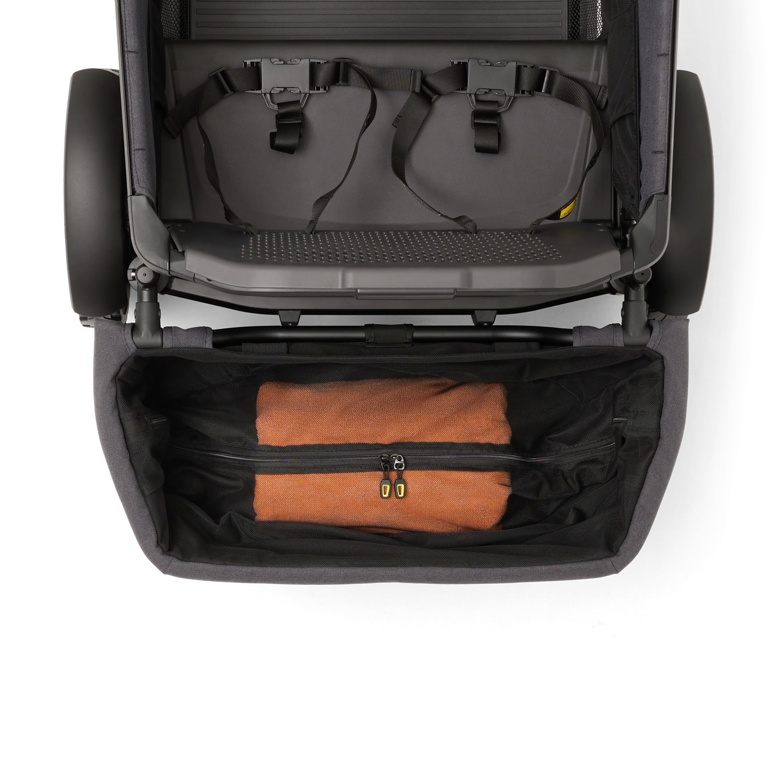 Veer rear basket on a family park outing showing convenient extra storage