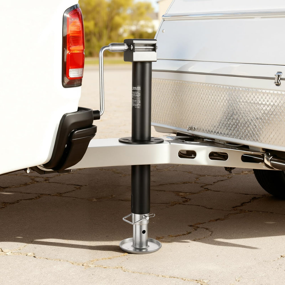 VEVOR jack next to measuring tape showing travel range and size for planning