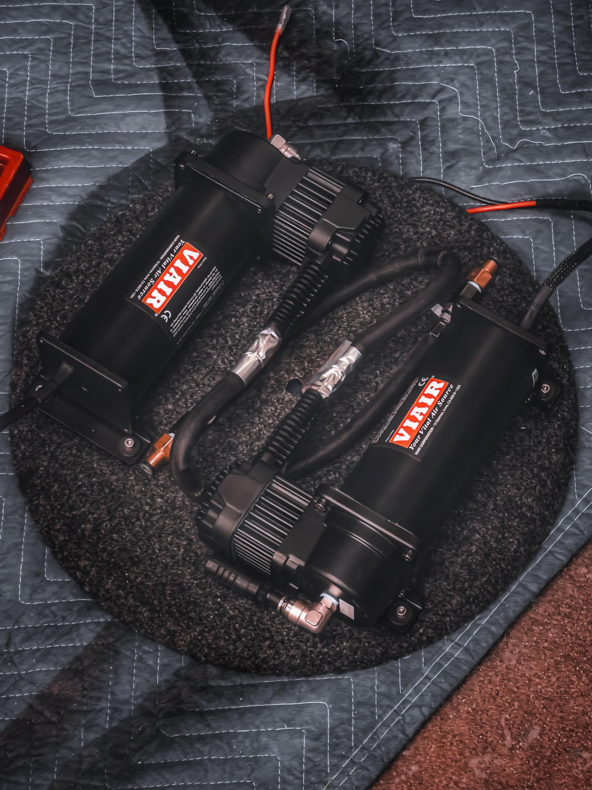 VIAIR compressors installed under hood demonstrating space-saving fit and easier fills