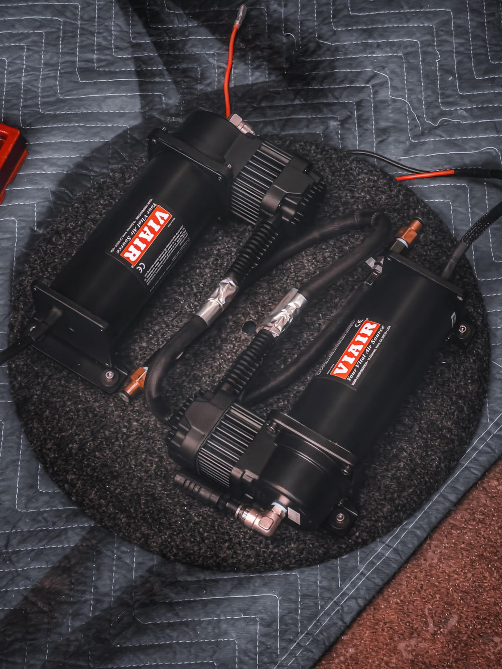 VIAIR compressors installed under hood demonstrating space-saving fit and easier fills