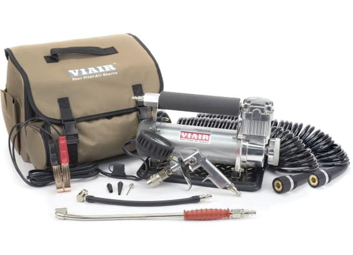 VIAIR compressor next to a hand for size comparison and portable transport benefit