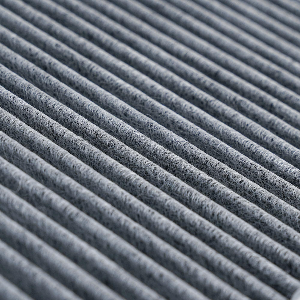 Close-up of VION activated carbon layer highlighting odor adsorption and improved comfort
